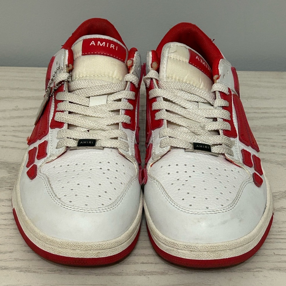 Red and white Amiri trainers